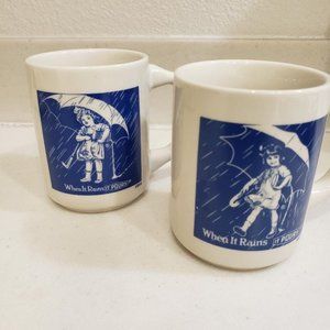 LOT 2 VINTAGE SALT "WHEN IT RAINS IT POURS" MUGS- GIRL W/ UMBRELLA 1914 & 1921